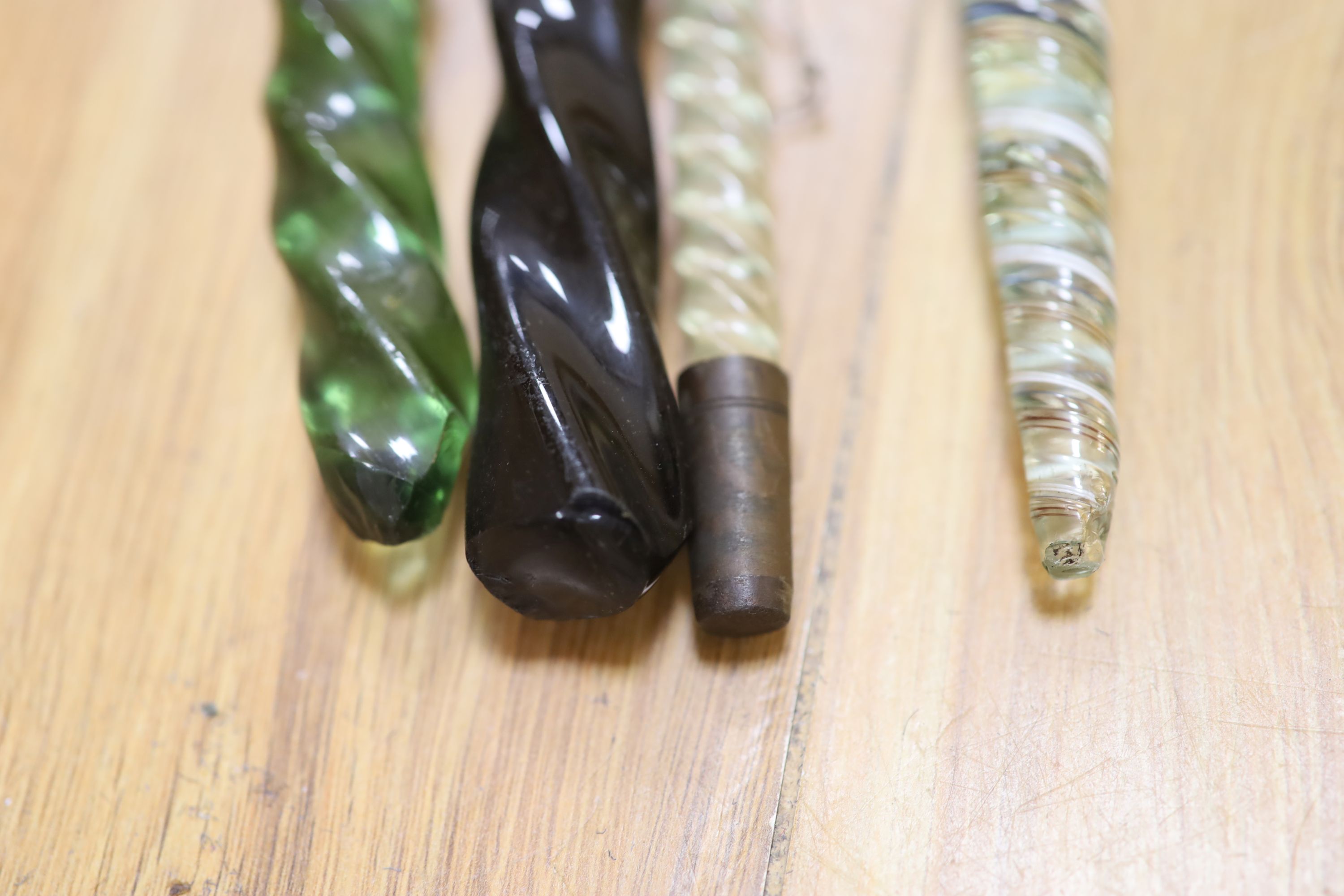 A 19th century Nailsea glass walking stick and three others (4)